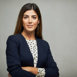 Studio headshot on white background. Spanish model.